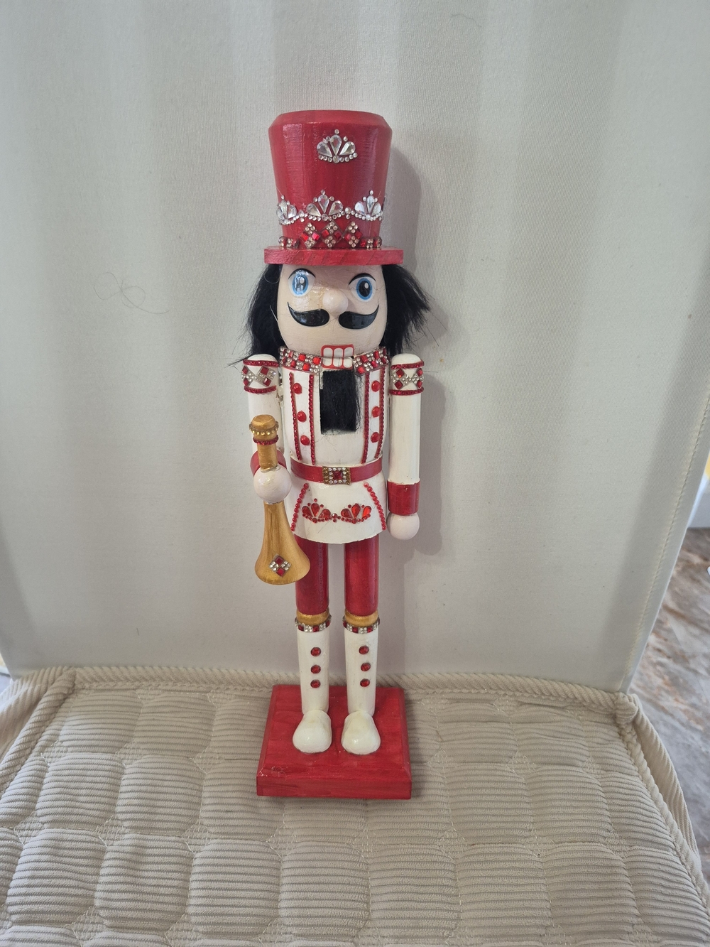 Red and White Decorative Nutcracker With Horn